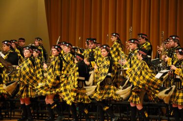 Members of the Scot Band perform on the McGaw Chapel stage.